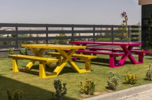 Yellow and Pink PatioSphere picnic tables